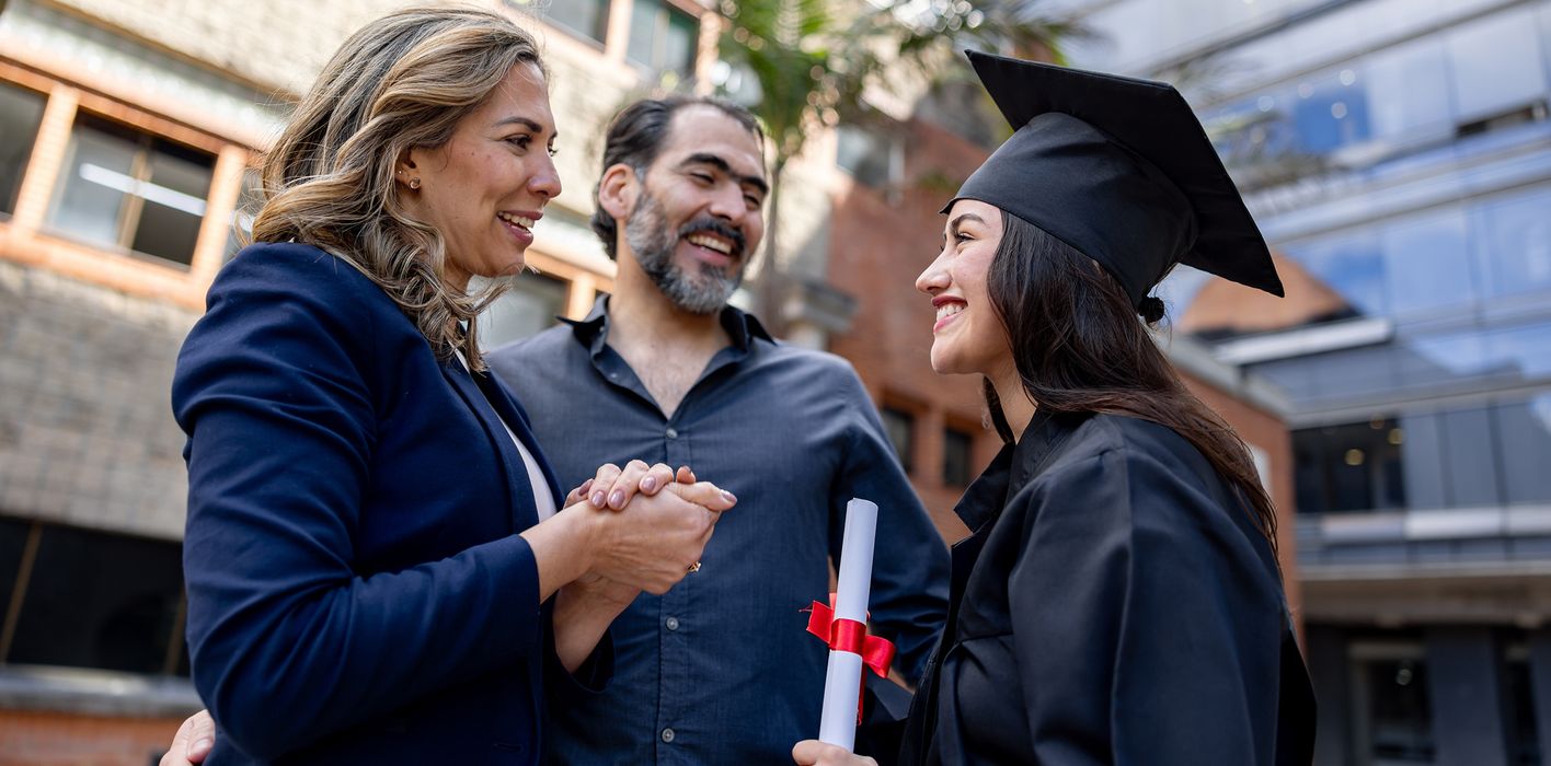 parents-congratulating-graduate-daughter