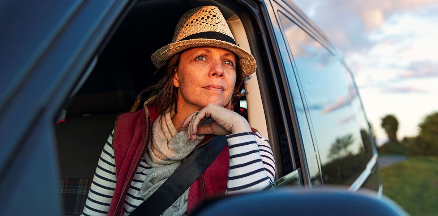 A woman in nature considers options for an inheritance.