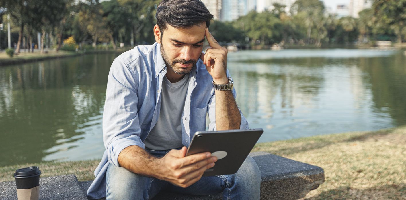 Man reading Northwestern Mutual’s weekly market commentary.