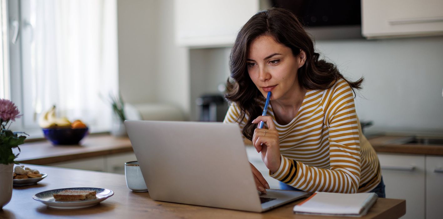Woman reading about Bitcoin ETPs from Northwestern Mutual Wealth Management Company