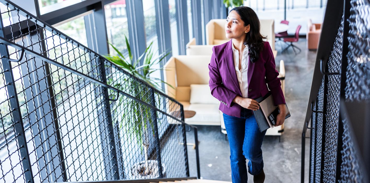Woman thinking about what she read in Northwestern Mutual’s Quarterly Market Commentary.