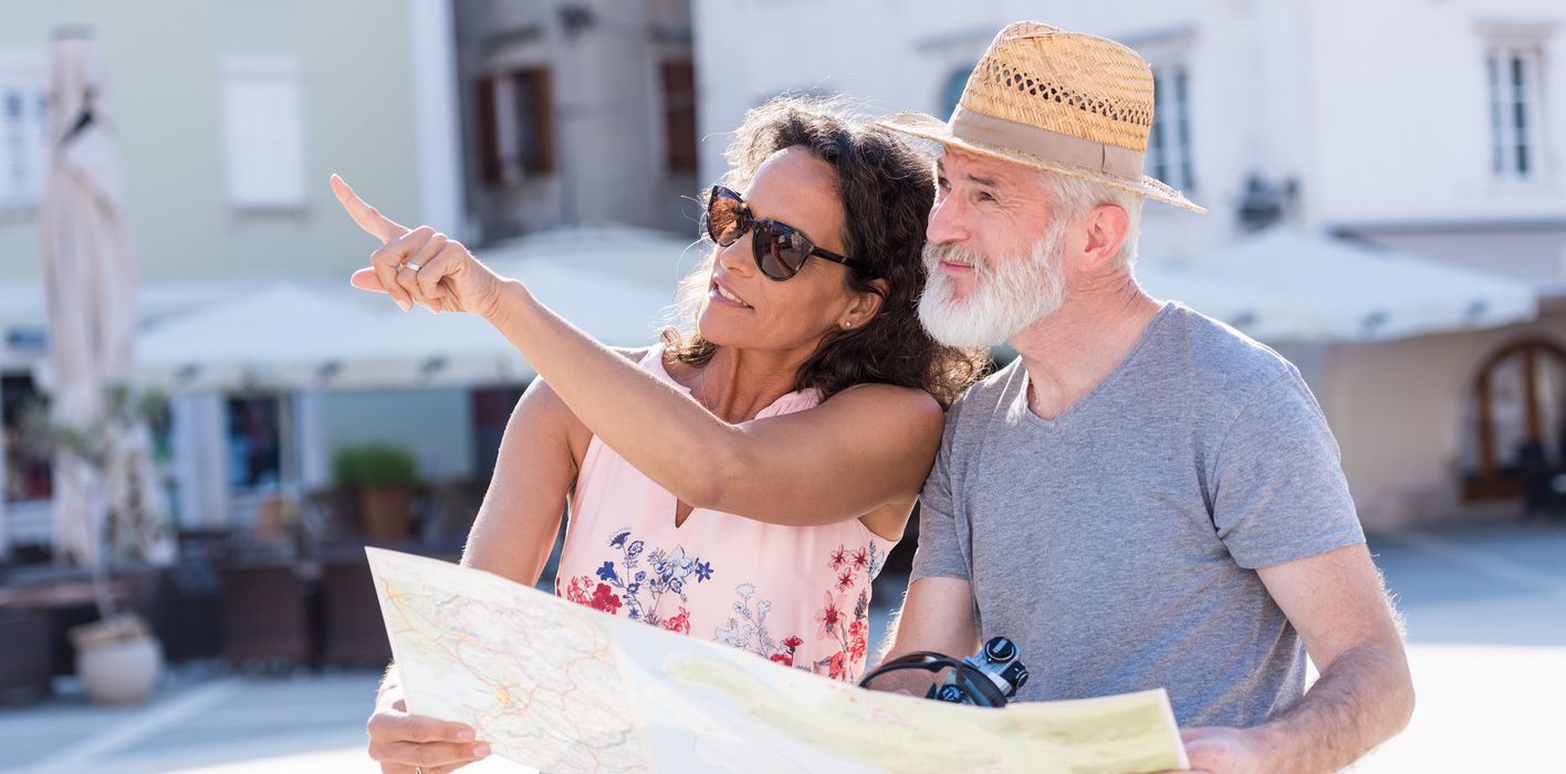 Couple on vacation looking at a map