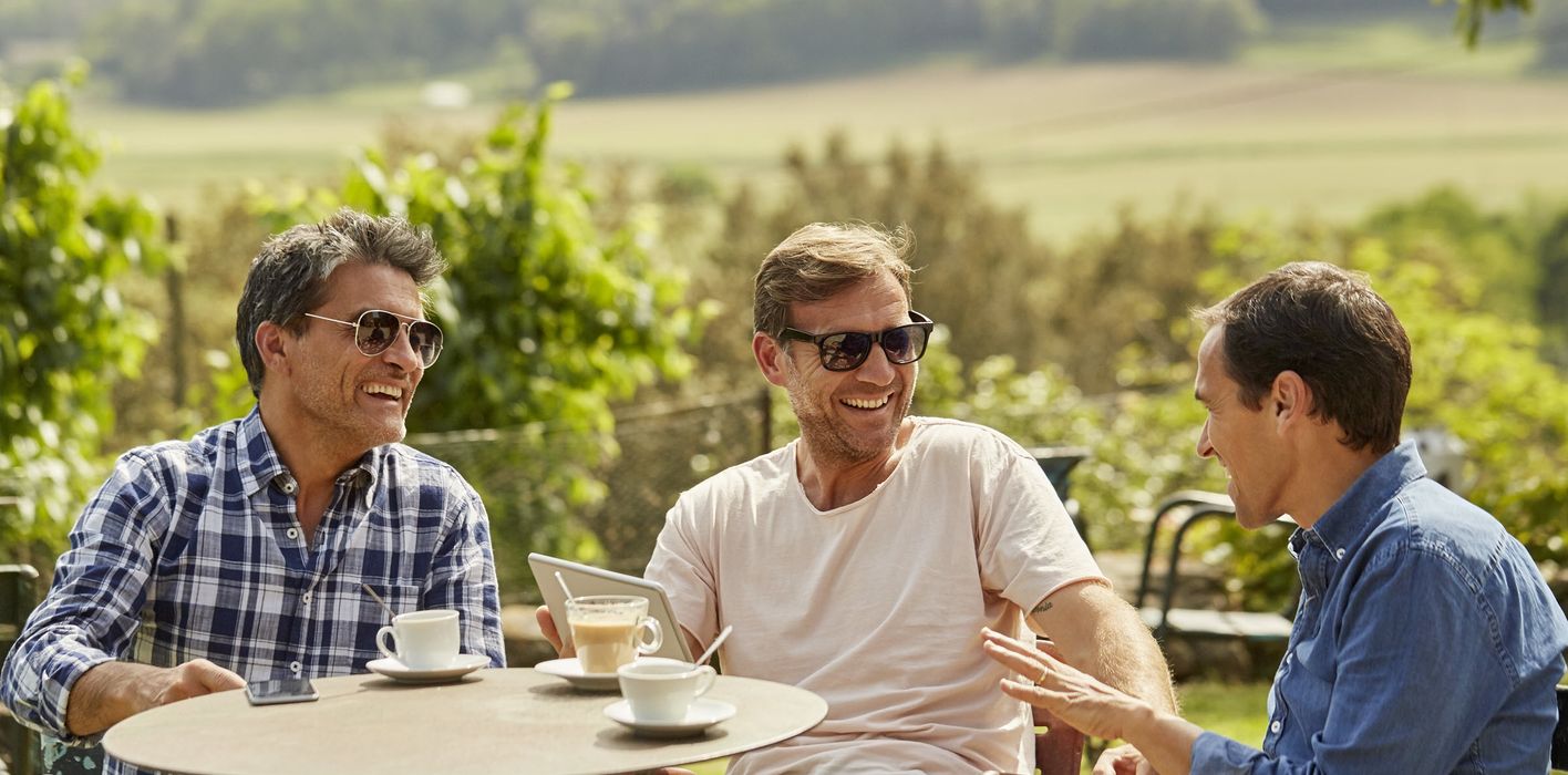 Friends talking about what they read in Northwestern Mutual’s Weekly Market Commentary.