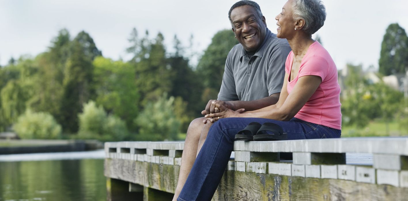 Couple enjoying the beautiful day and talking about the recent market rally.
