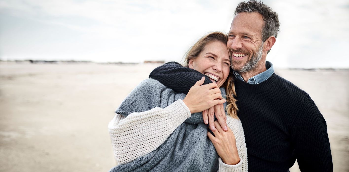 Couple hugging on beach