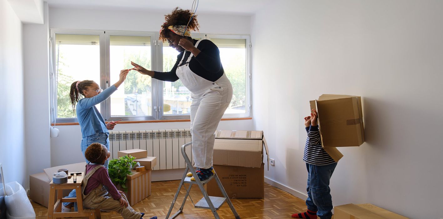 A mother with her two kids moving into a new home