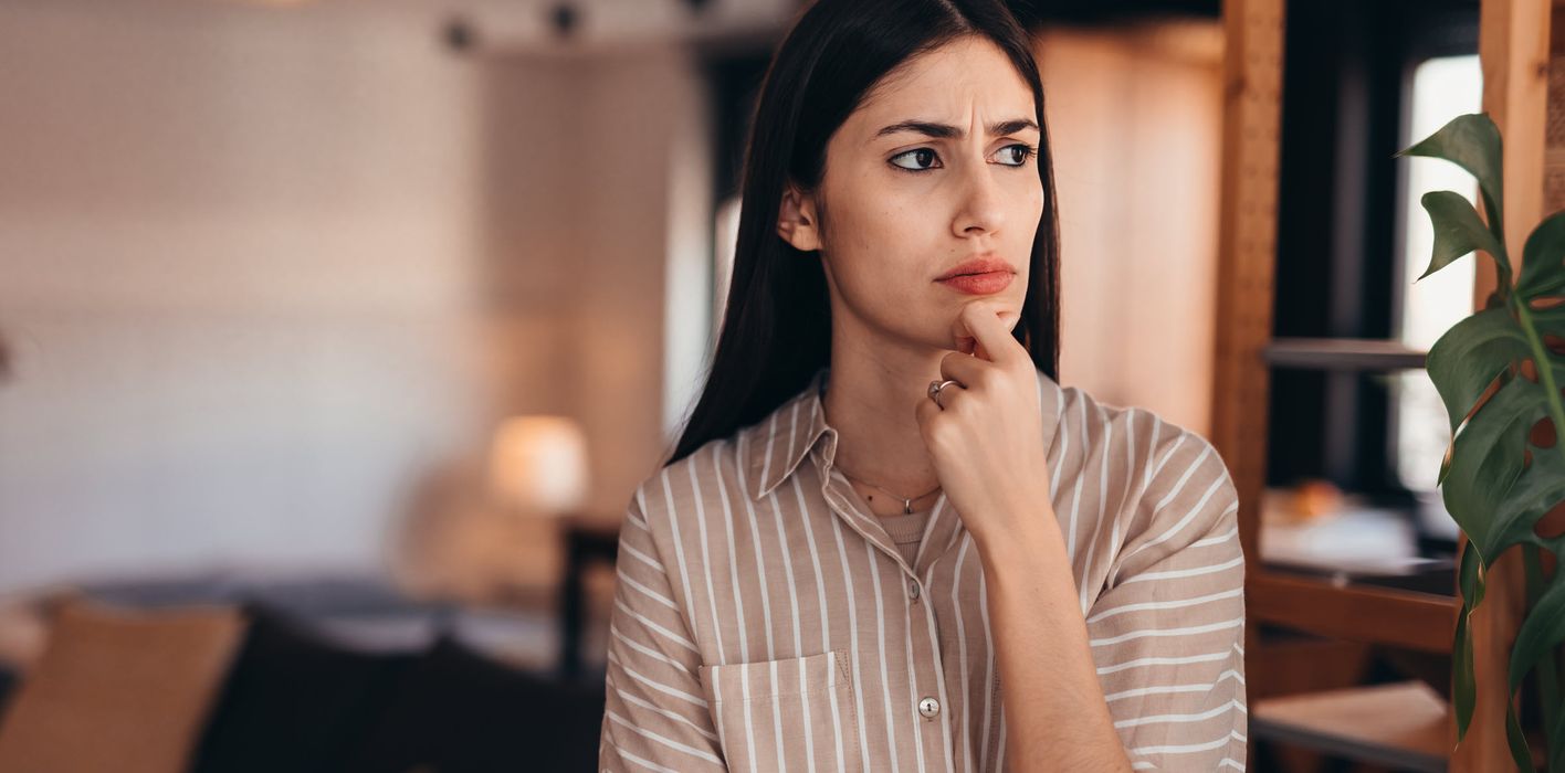 Woman thinking through a decision.