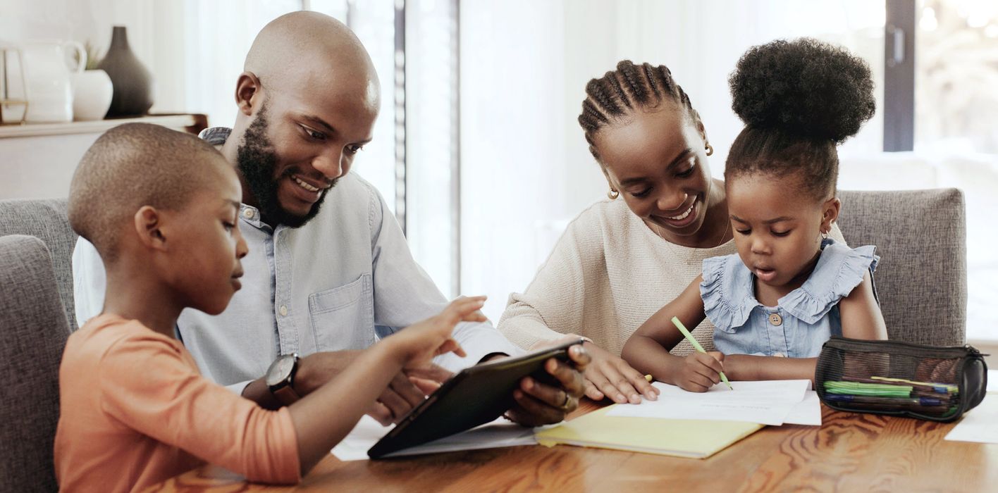 A family enjoys time together at the dining table.