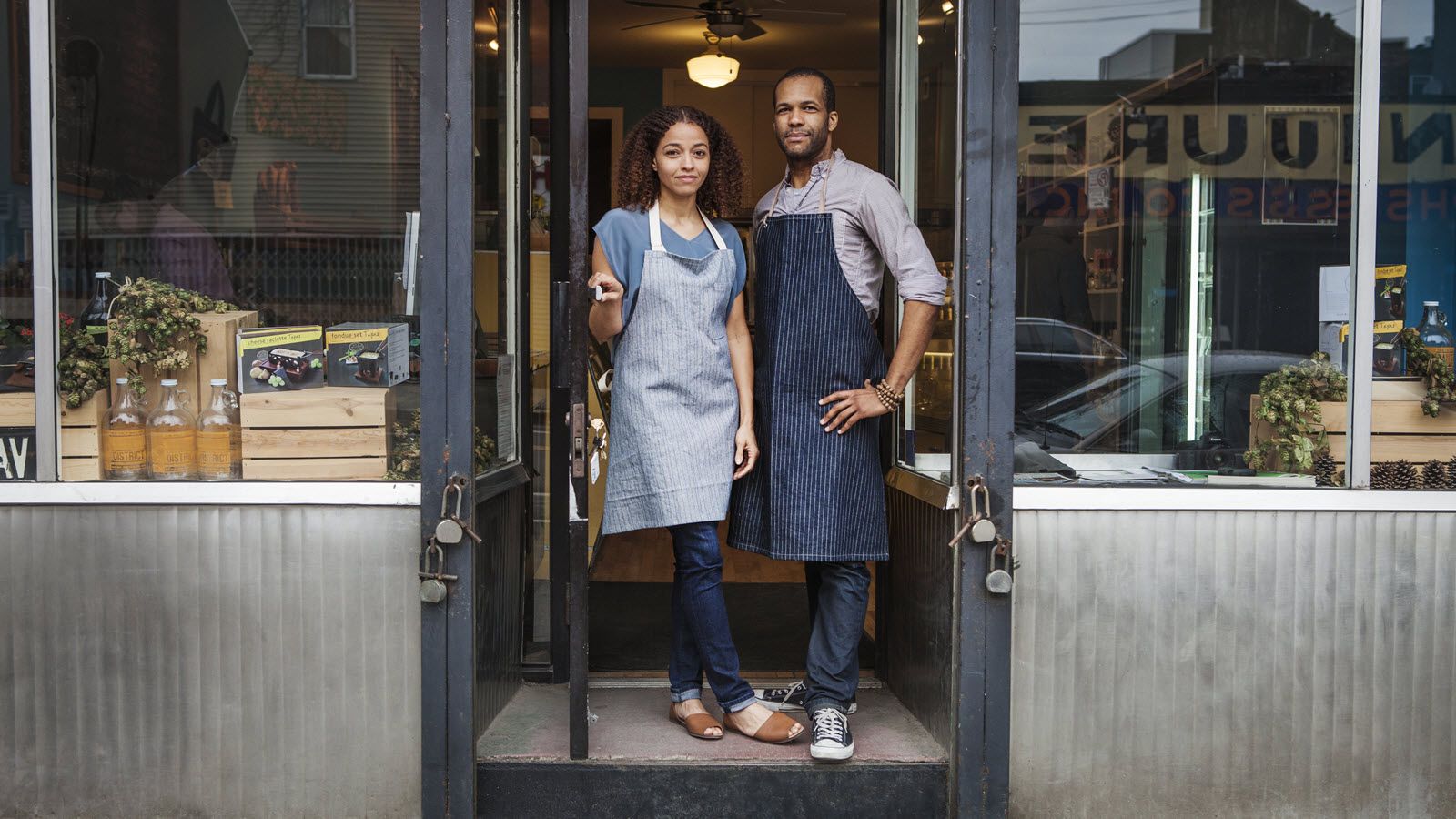 Business owners in doorway.
