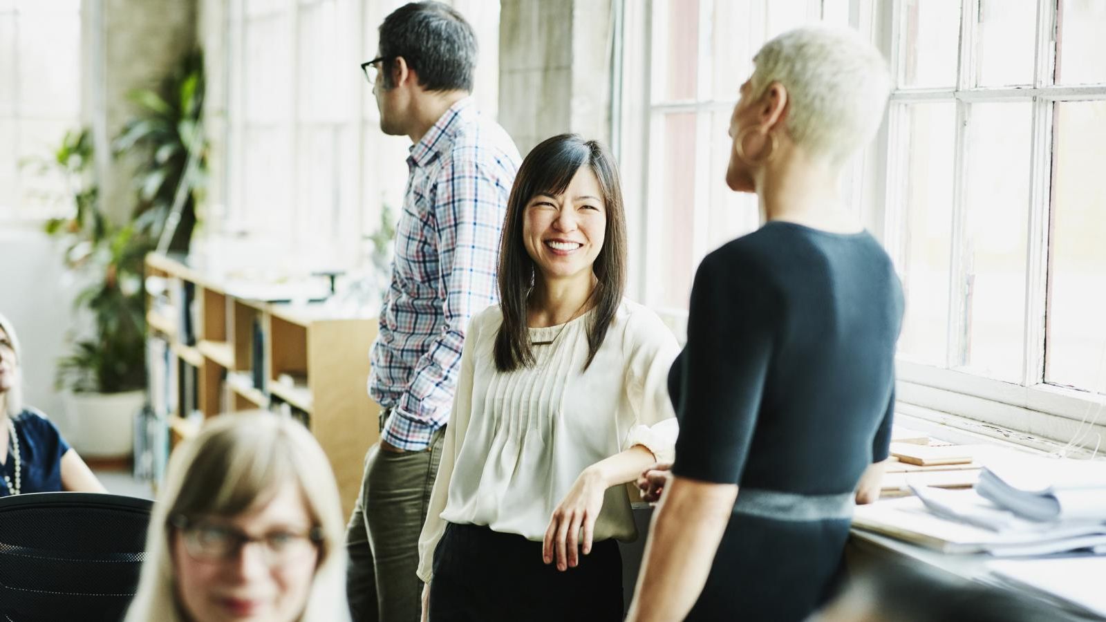 Key employee business women talking in business meeting