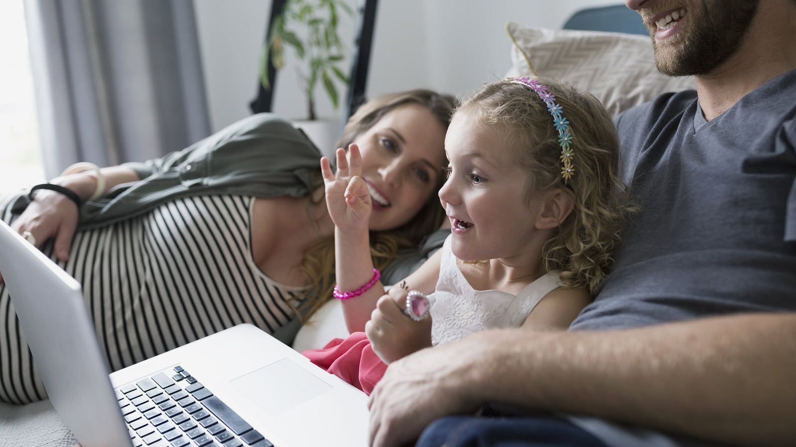 Family reading about the different types of life insurance. 