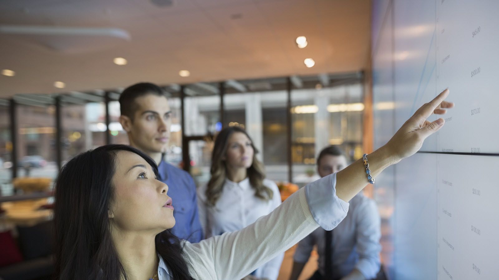 woman who learned tech skills for free running a meeting