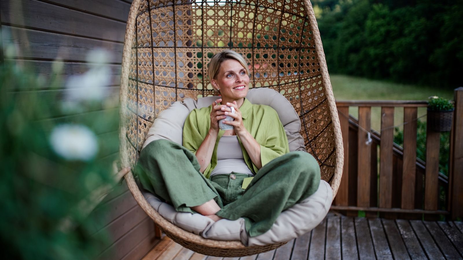 Woman feeling financially confident and enjoying her newly purchased home.