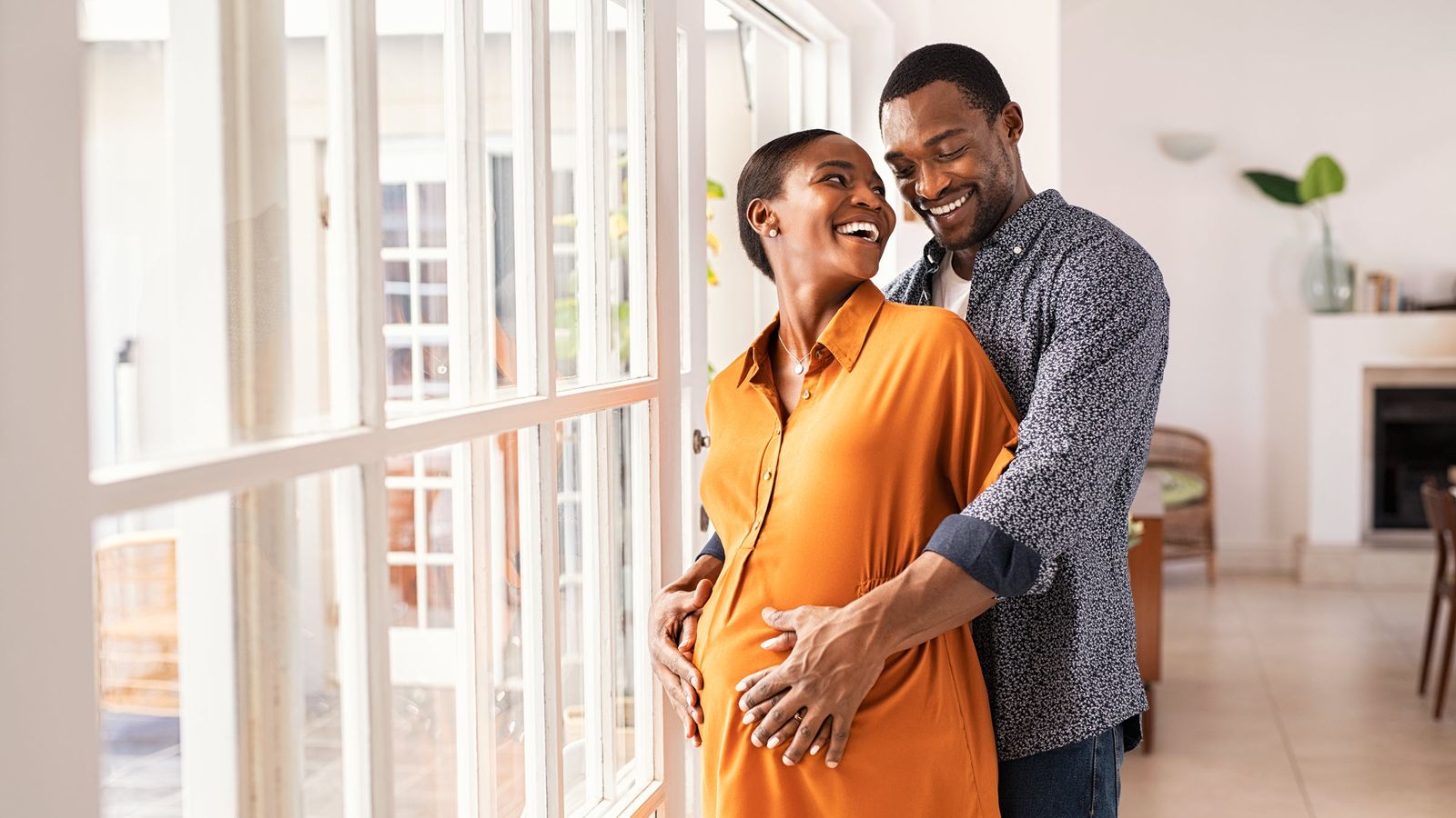 Pregnant couple thinking about life insurance for new parents