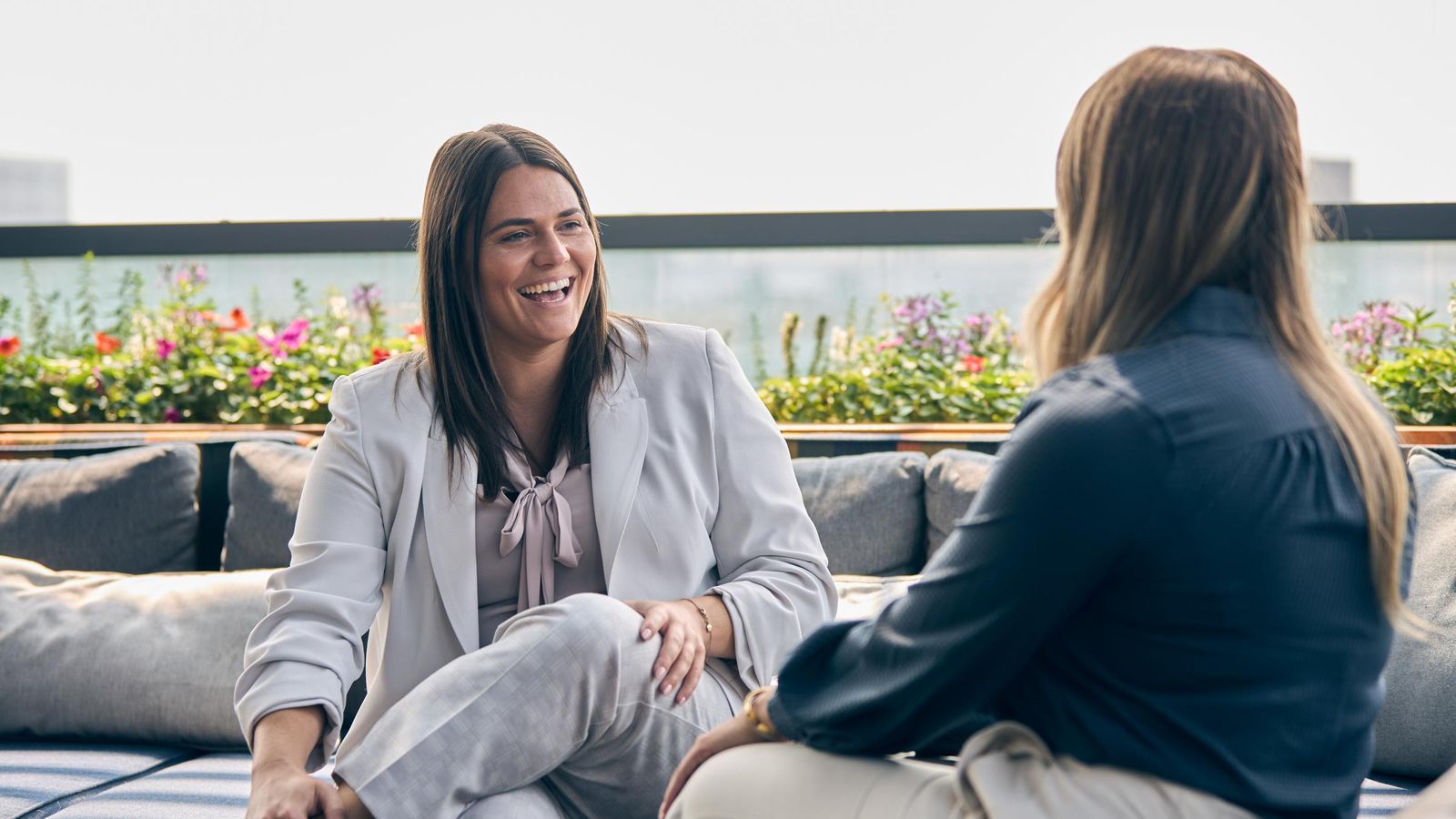 Businesswoman advisor laughing on rooftop