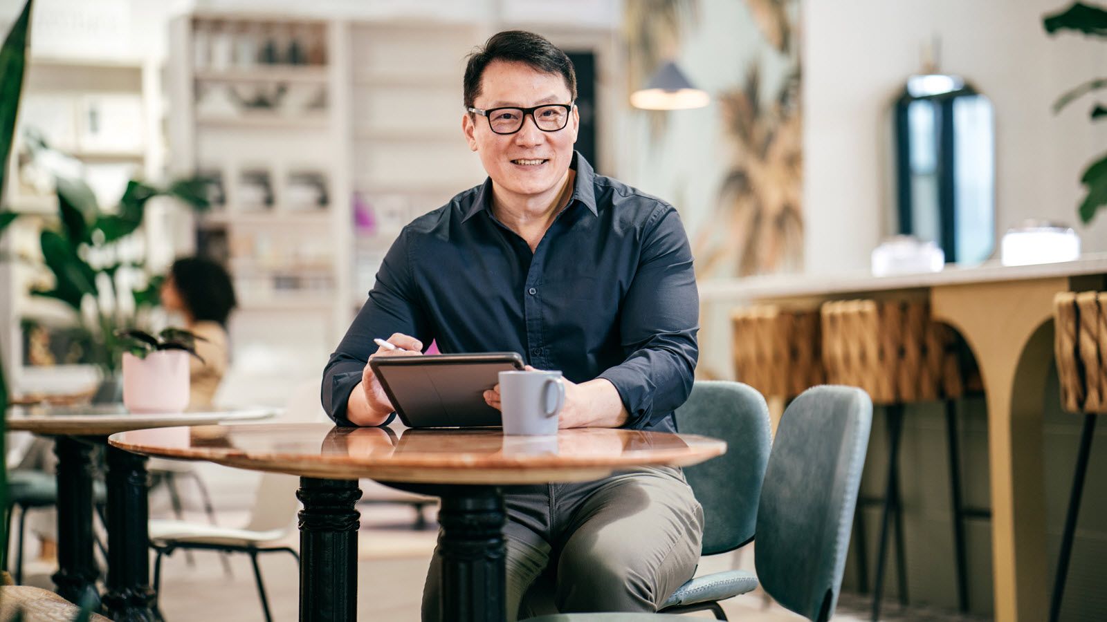 Man at a table reading Northwestern Mutual Asset Allocation Focus