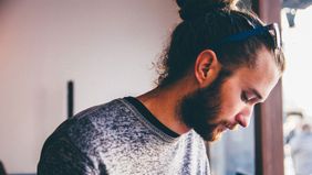 Contemplative young man going through a divorce