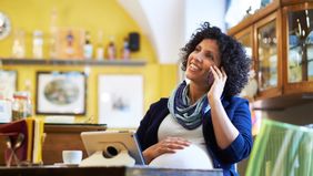 Pregnant woman discussing money musts before baby arrives