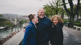 Laughing family learning why life insurance matters in estate planning