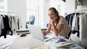 Woman on laptop adding in digital assets to her estate planning