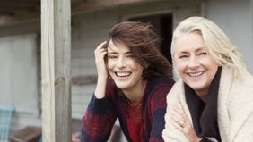 Happy mom and daughter having the eldercare talk