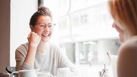 Friends getting coffee talking about student loans 101