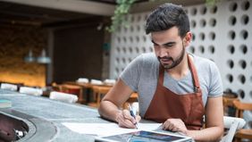 Entrepreneur at work getting his finances in order