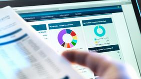 Person on laptop researching asset allocation