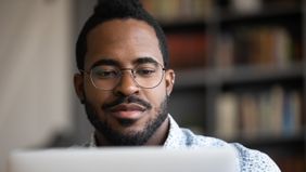 Man reading Northwestern Mutual Market Commentary