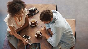 Woman explaining to a colleague what a financial advisor does