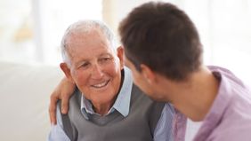 Father and son determining long-term care should be part of financial plan