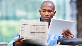 Man looking at the difference between stocks and bonds