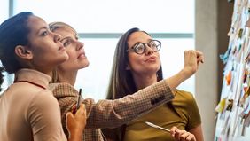 Group of women discussing the difference between a career mentor and a sponsor