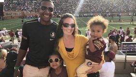 Financial planner and his family at BB&T Field