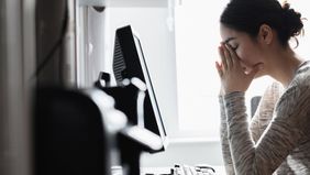 Woman burned out at work.