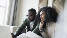 Couple looking at their interest rates.