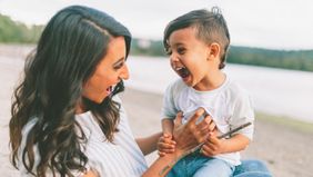 Mother and son laughing.