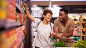 a couple shopping at the grocery store