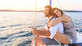 newlywed couple on honeymoon sailing