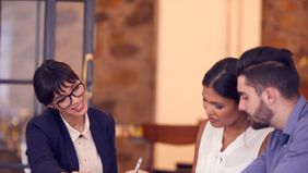 A couple works with their financial advisor