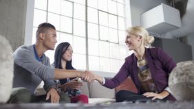 A couple is asking a financial advisor how she is paid.