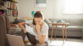 Woman consolidating her debt online