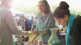 woman hosting garage sale 