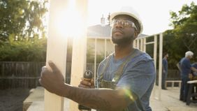 Man building a home.
