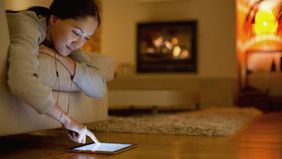 Woman in front of fire researching whether disability insurance premiums are tax deductible.