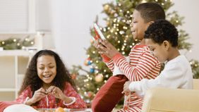 Kids opening meaningful gifts on Christmas. 