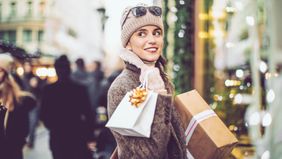 A young woman shopping during the holidays