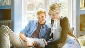 Couple taking a quiz to find out if they’re financially ready for a baby. 