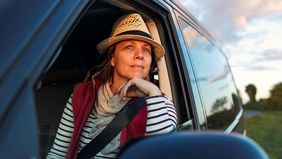 A woman in nature considers options for an inheritance.