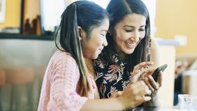 Mother using a teachable moment to help her daughter grow up to be money-smart